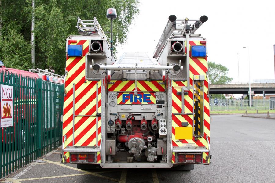 Fire appliance behind daylight scene