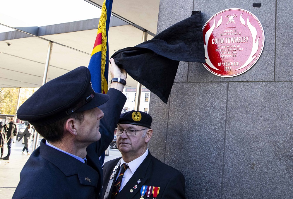 Colin Townsley's red plaque being unveiled