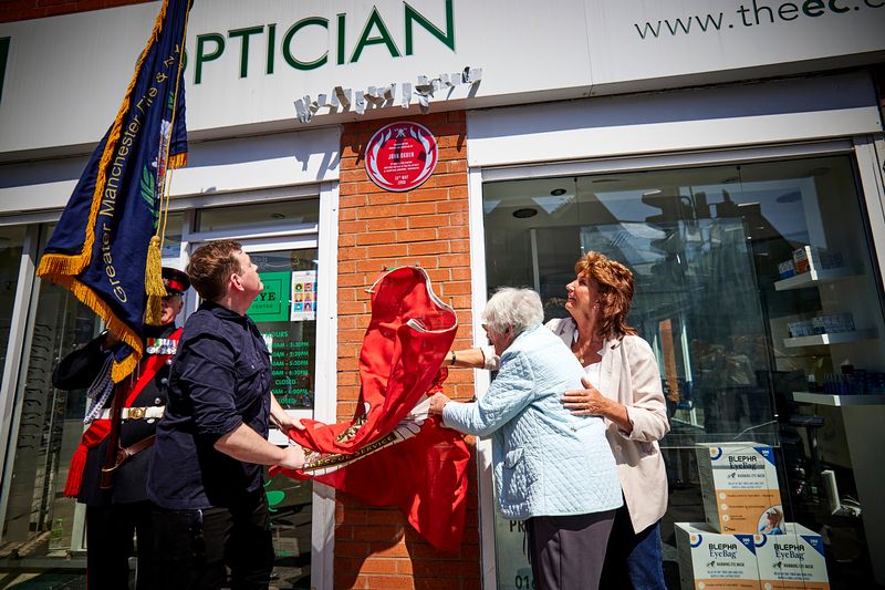 The plaque being unveiled