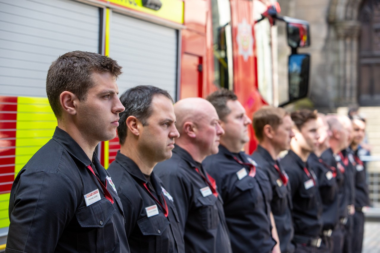 Firefighters line up at memorial ceremony
