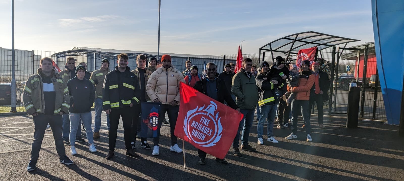 Firefighters gather outside fire authority meeting