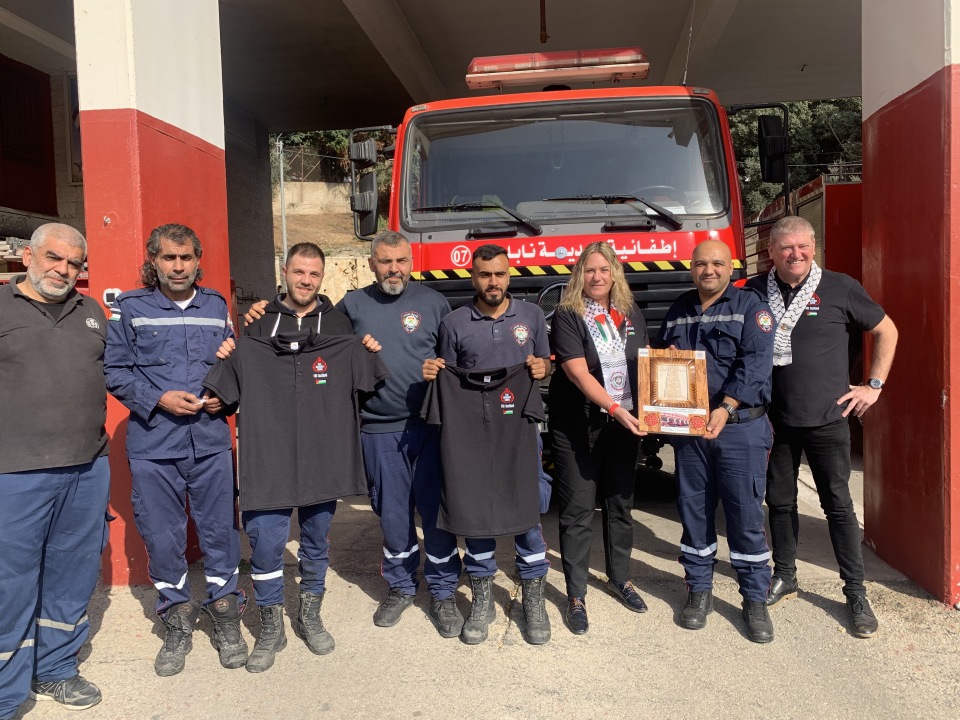 FBU officials and members with Palestinian firefighters