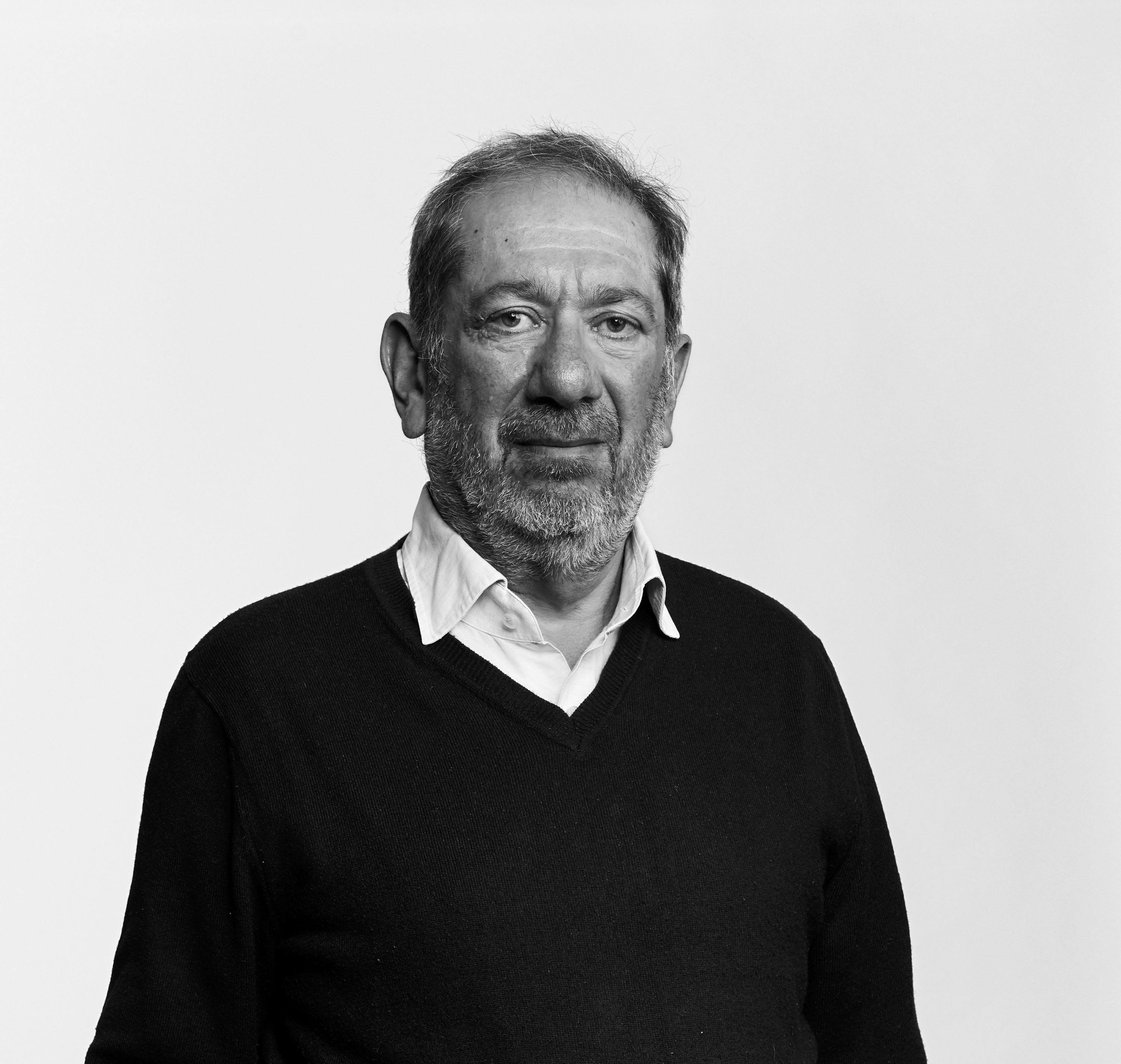 Elkan Abrahamson looking at camera in black and white