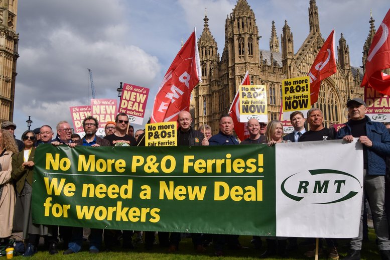RMT members outside parliament with a banner saying: No more P&O ferries! We need a new deal for workers"