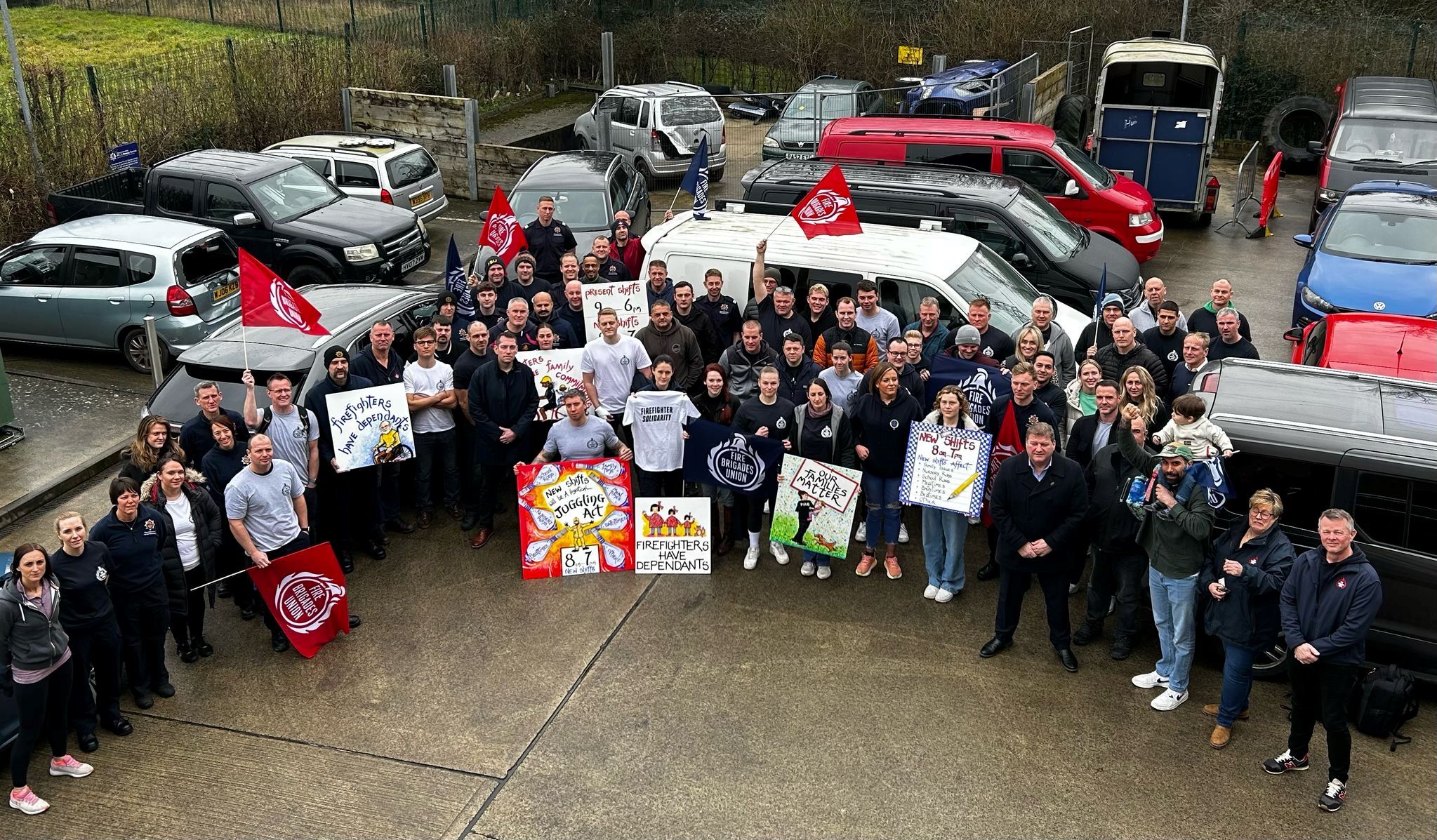 FBU members gathering with signs at meeting against shift changes