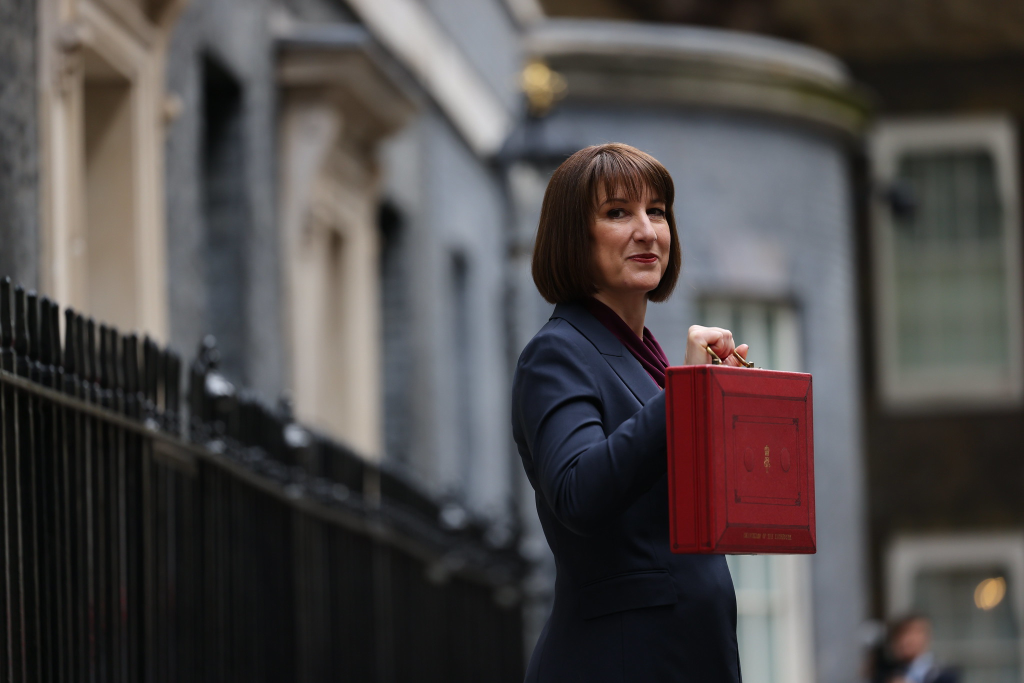Rachel Reeves holding red budget briefcase outside downing street