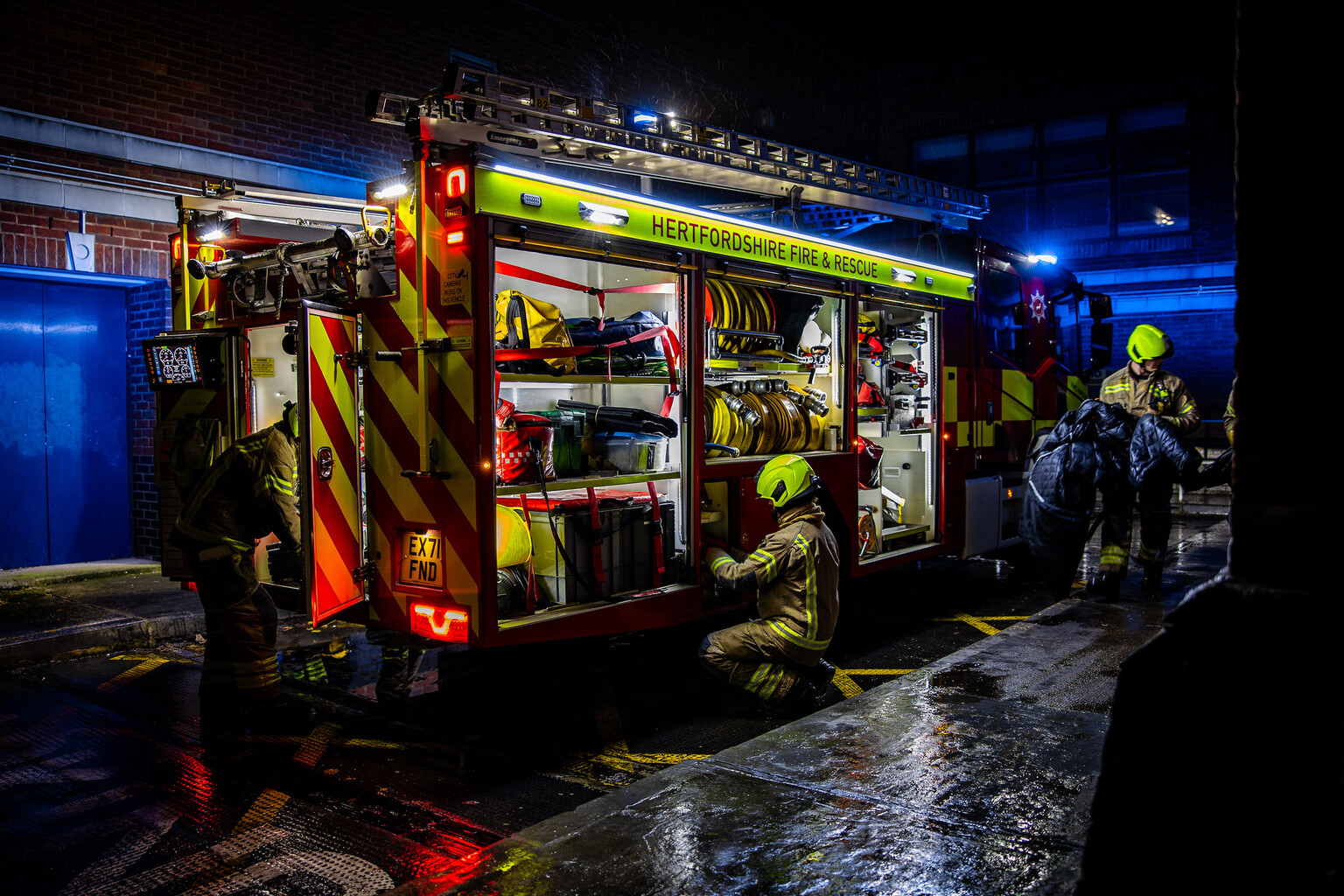 Firefighters working around fire truck - photo comp entry