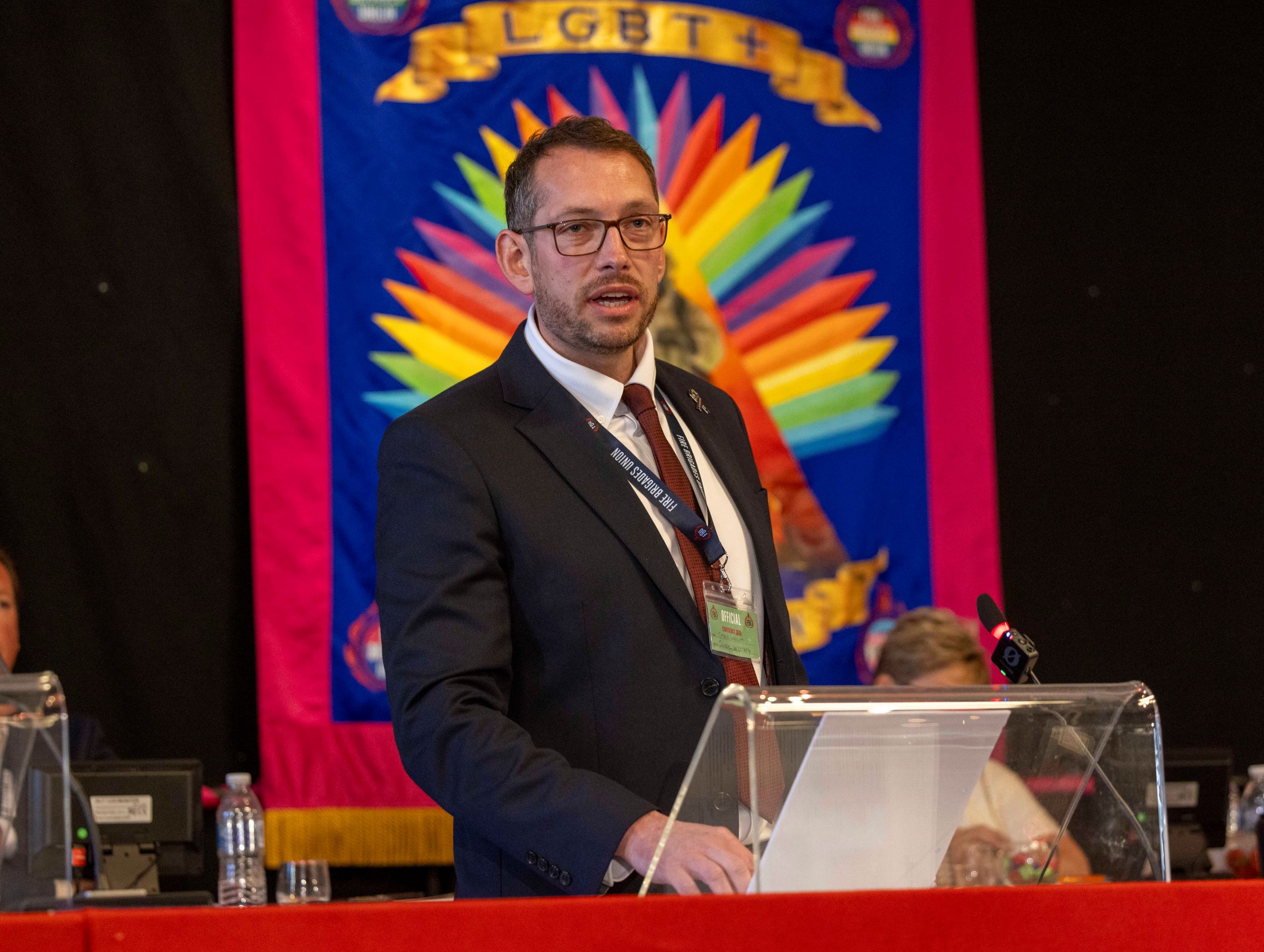 Steve Wright speaking at the podium of FBU conference 
