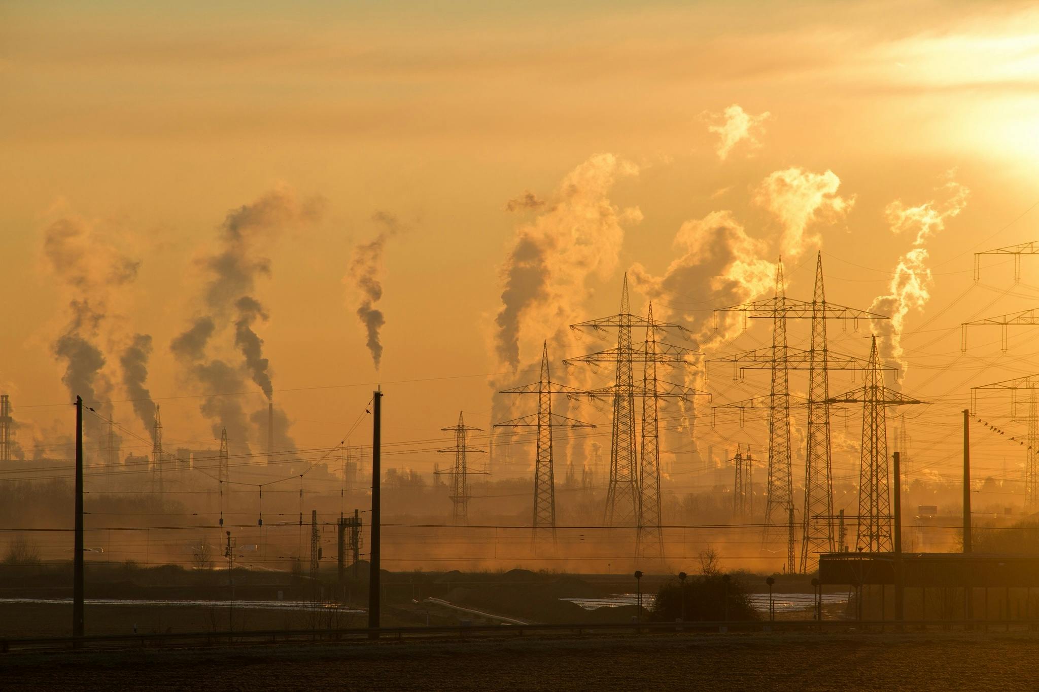 A landscape with pylons and polluted air
