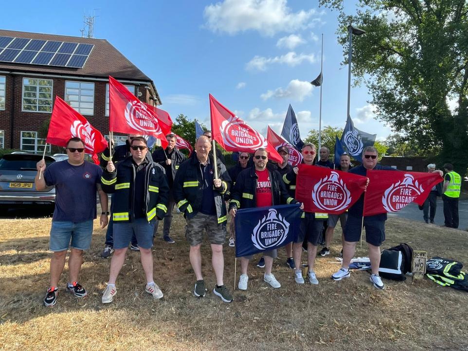 FBU members rally with flags outside fire authority meeting