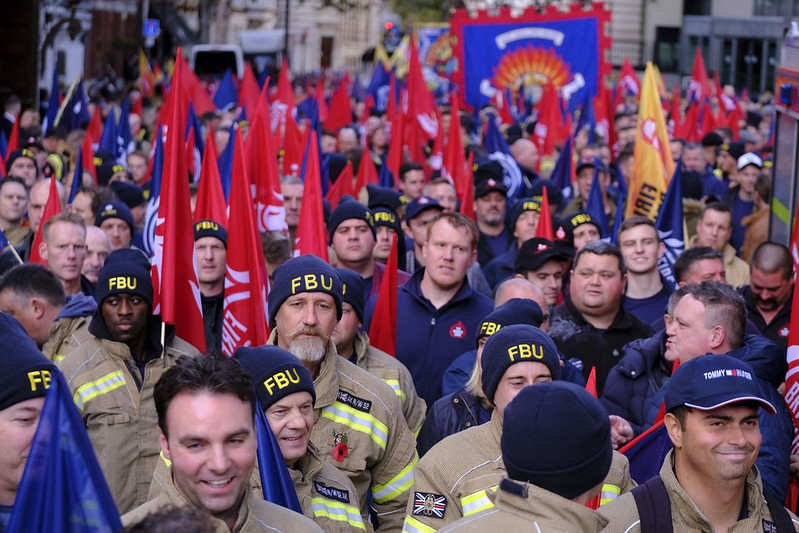 march with FBU flags in street - 2023 rally
