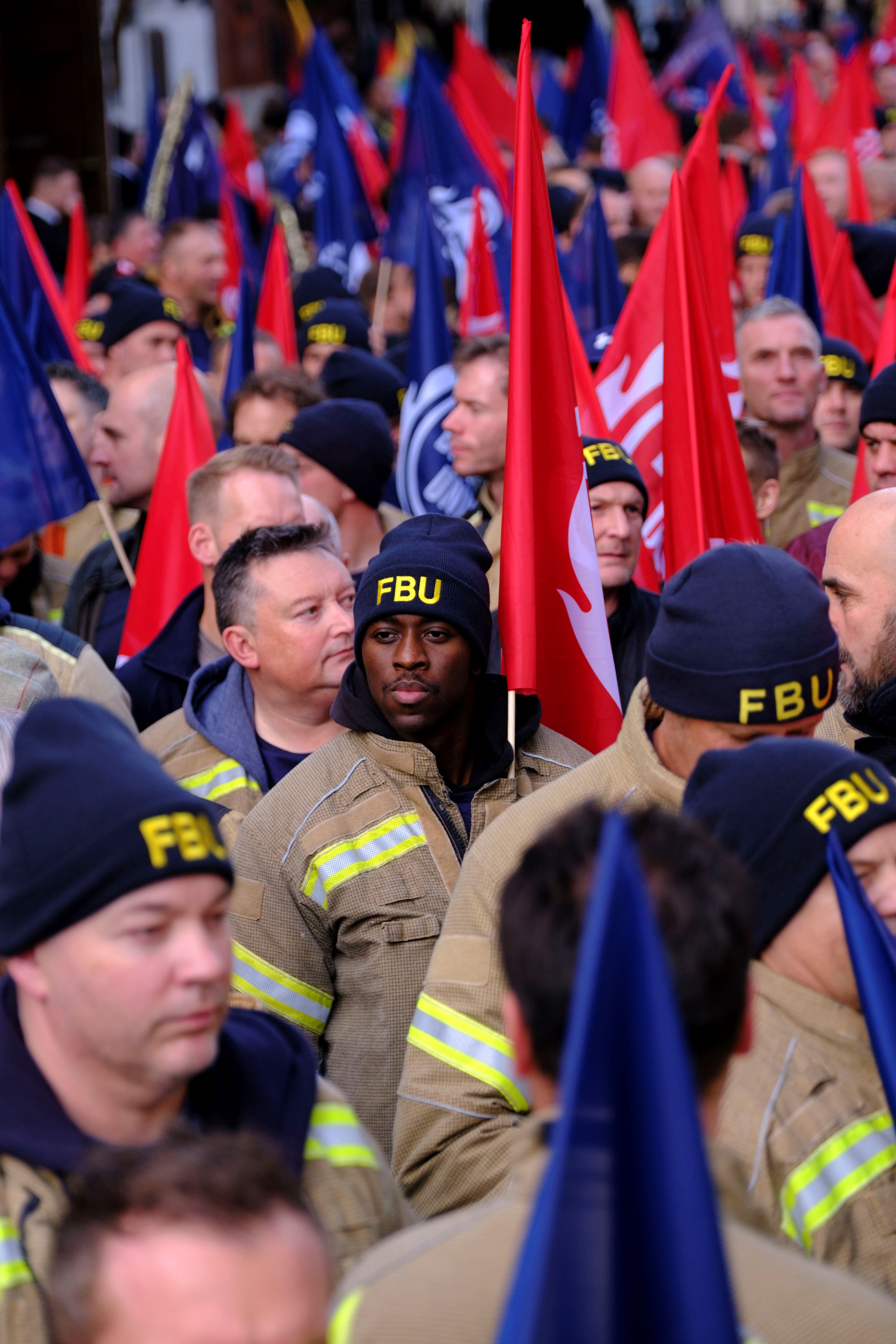 Portrait in crowd of firefighters attending firefighters manifesto rally