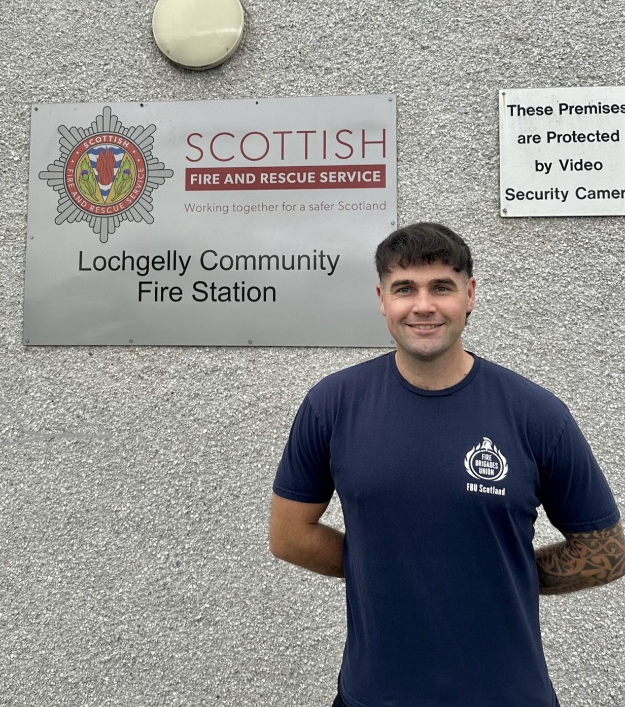 Jamie McDonald smiles outside Lochgelly fire station
