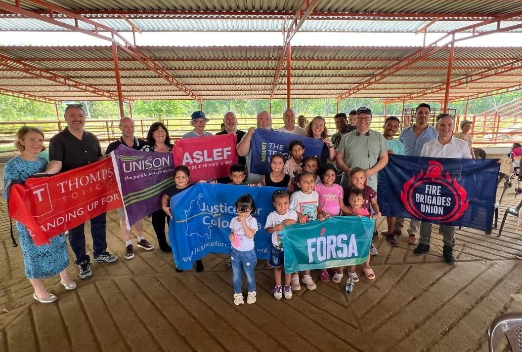 Delegations holding trade union banners in Columbia