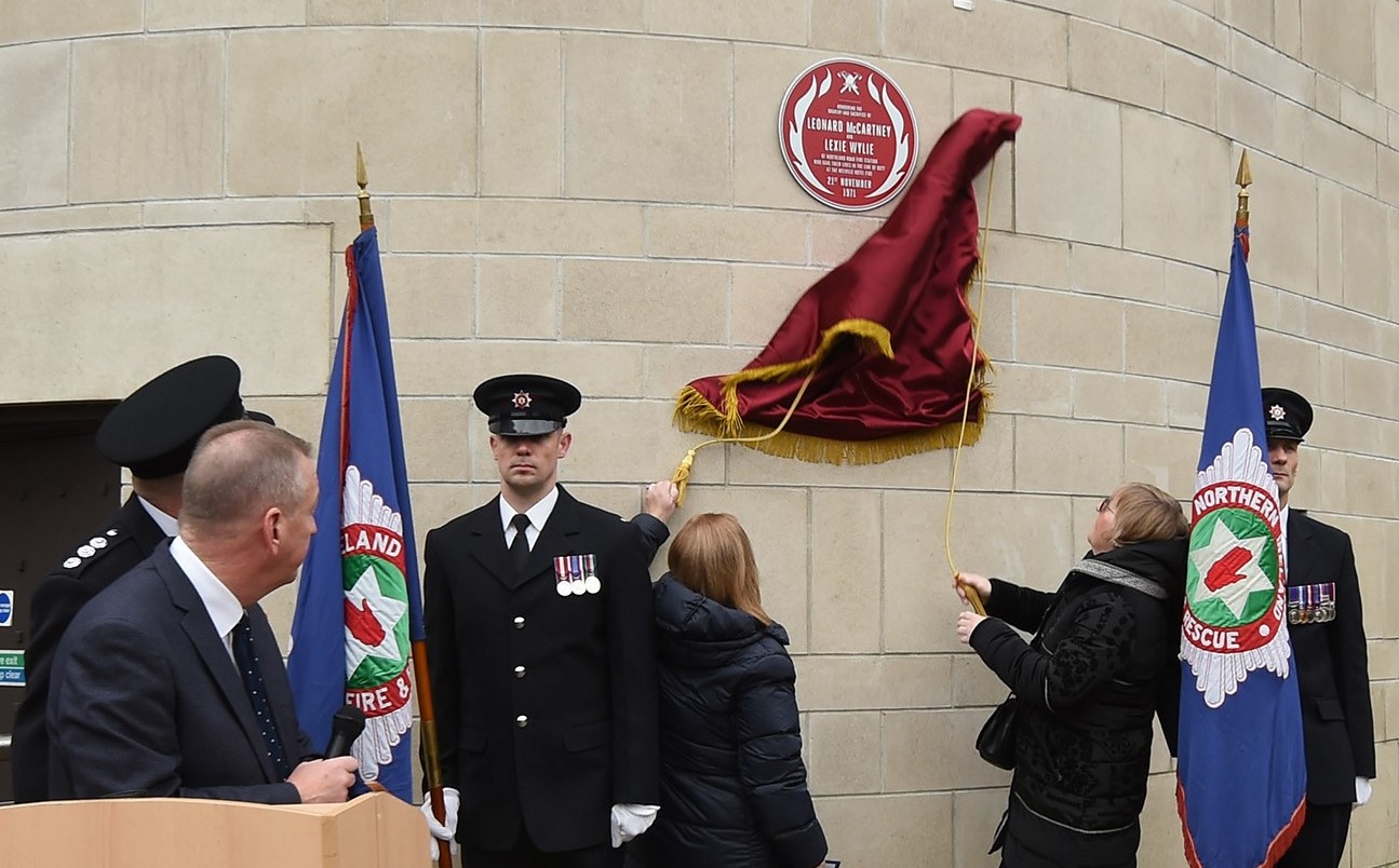 The plaque being unveiled