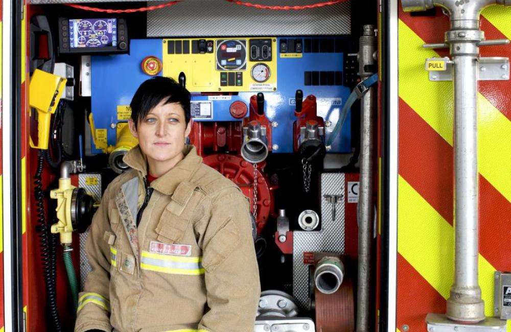female firefighter fire applicance