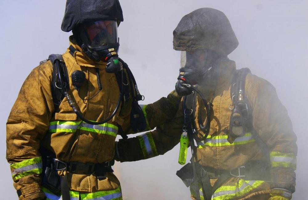 two firefighters smoke