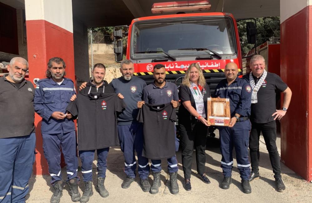 FBU officials and members with Palestinian firefighters