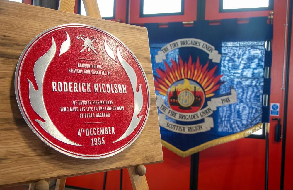Red plaque next to FBU banner