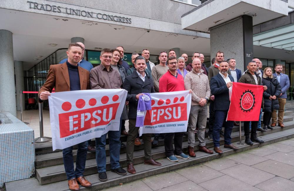 Firefighters from across Europe hold an EPSU banner outside Trades Congress House