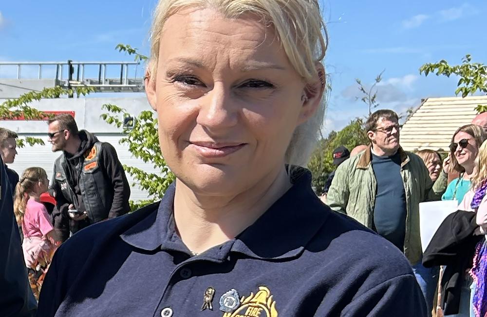 Rebecca Lewington smiling at camera wearing FBU polo shirt