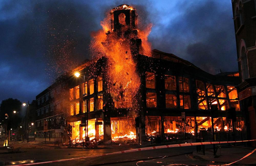 A department store on fire during the London riots