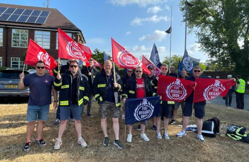 FBU members rally with flags outside fire authority meeting
