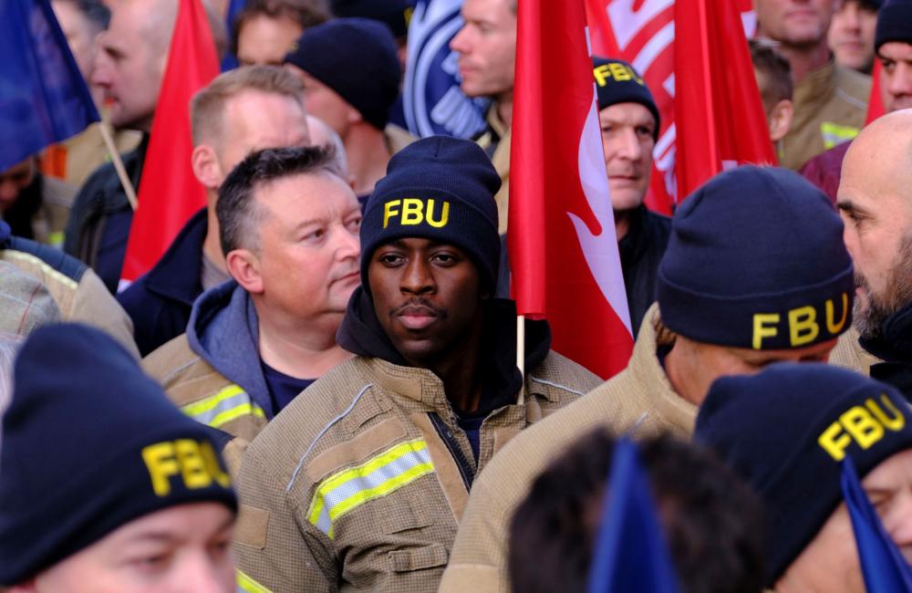 Portrait in crowd of firefighters attending firefighters manifesto rally