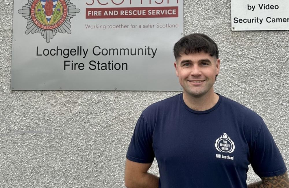 Jamie McDonald smiles outside Lochgelly fire station