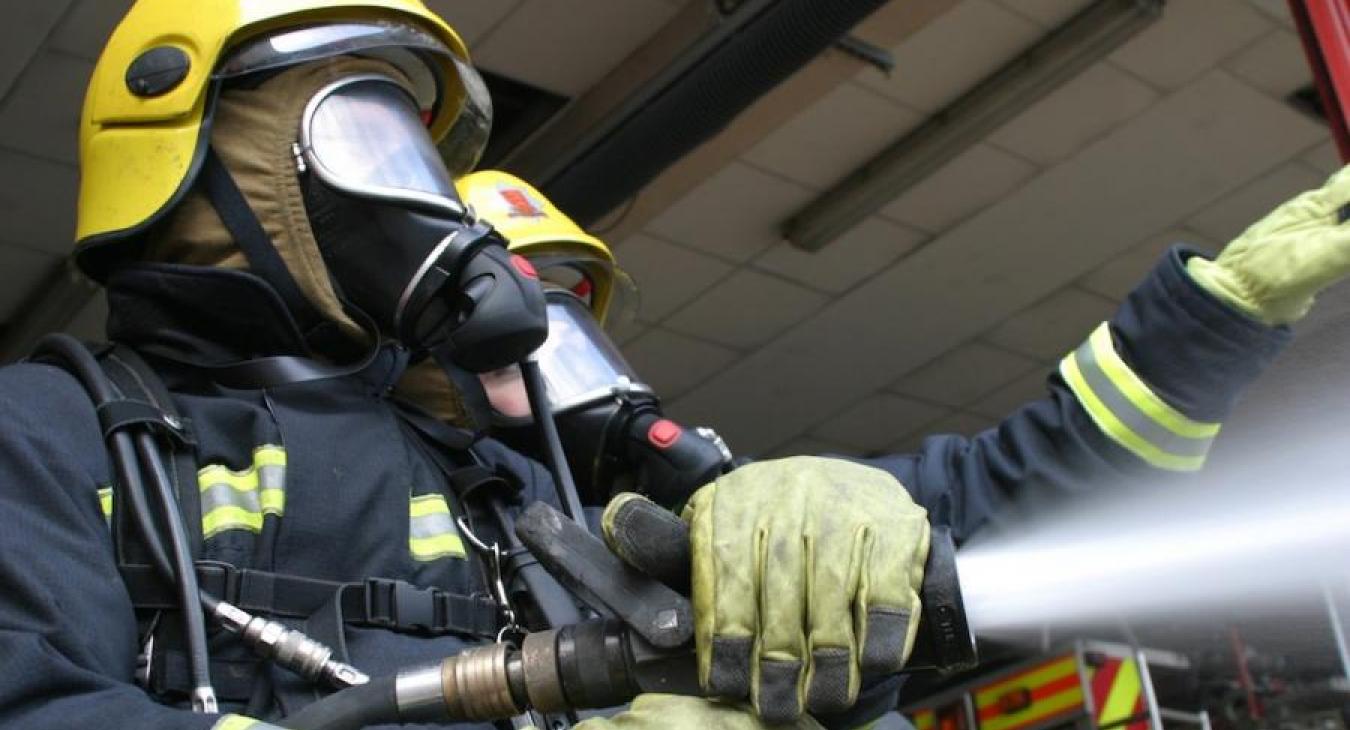 2 two firefighters hose water