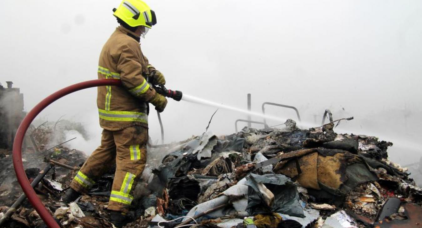 Firefighter hose water rubble