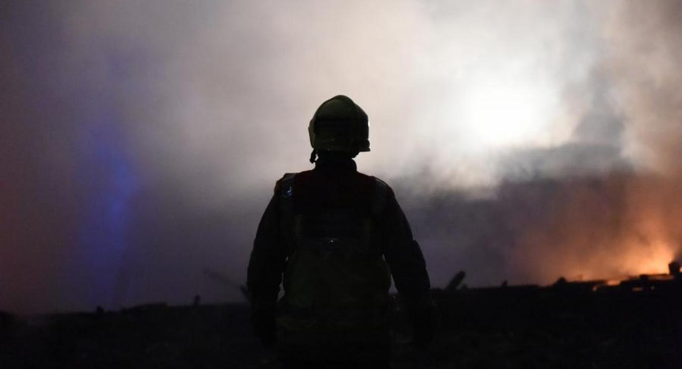 silhouette firefighter smoke night