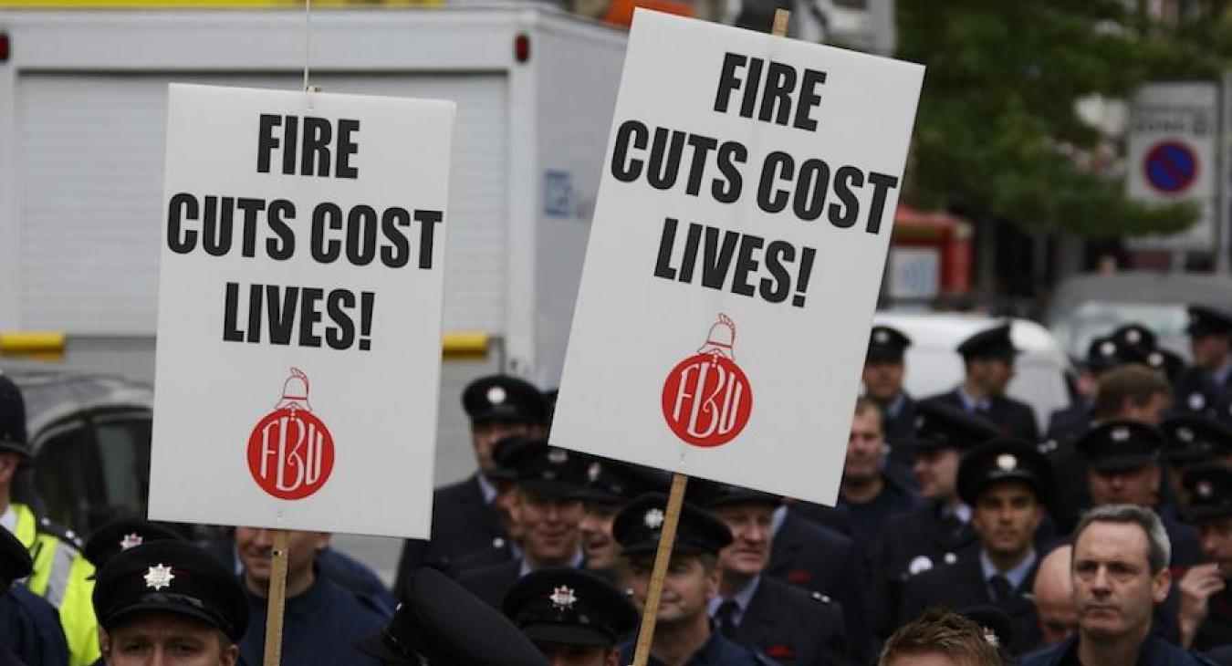 firefighters-holding-cuts-placards