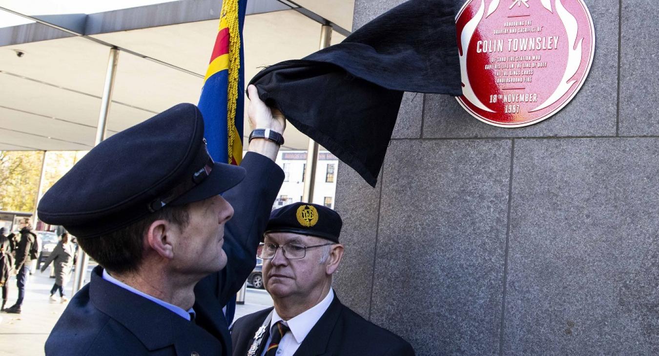 Colin Townsley's red plaque being unveiled