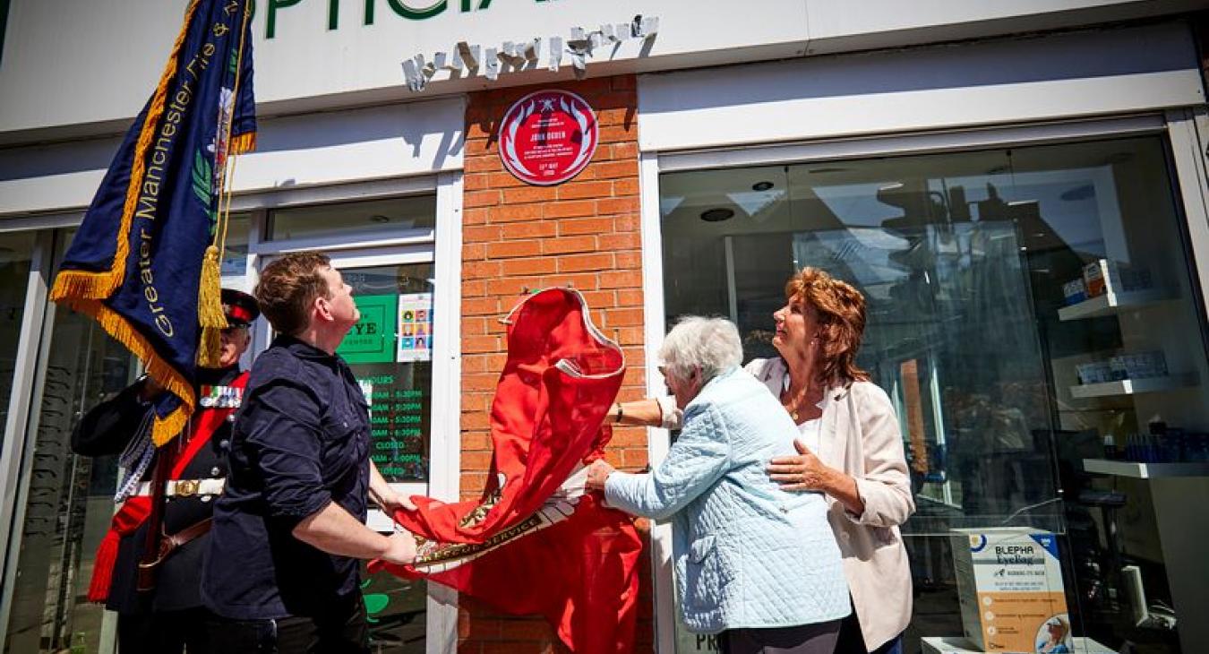 The plaque being unveiled