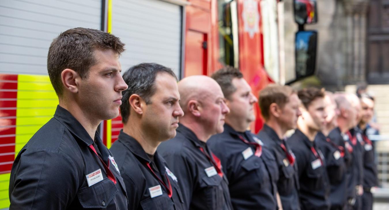 Firefighters line up at memorial ceremony