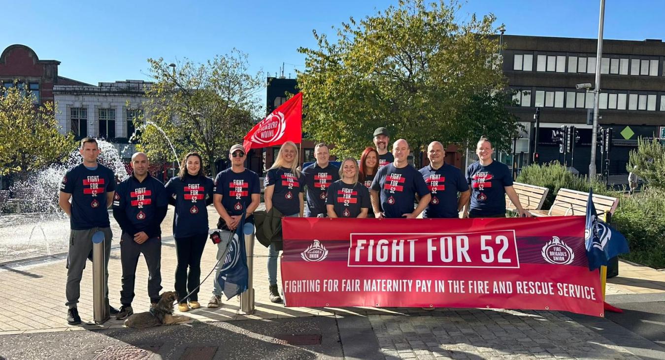 FBU members hold Fight 52 banner outside fire authority building