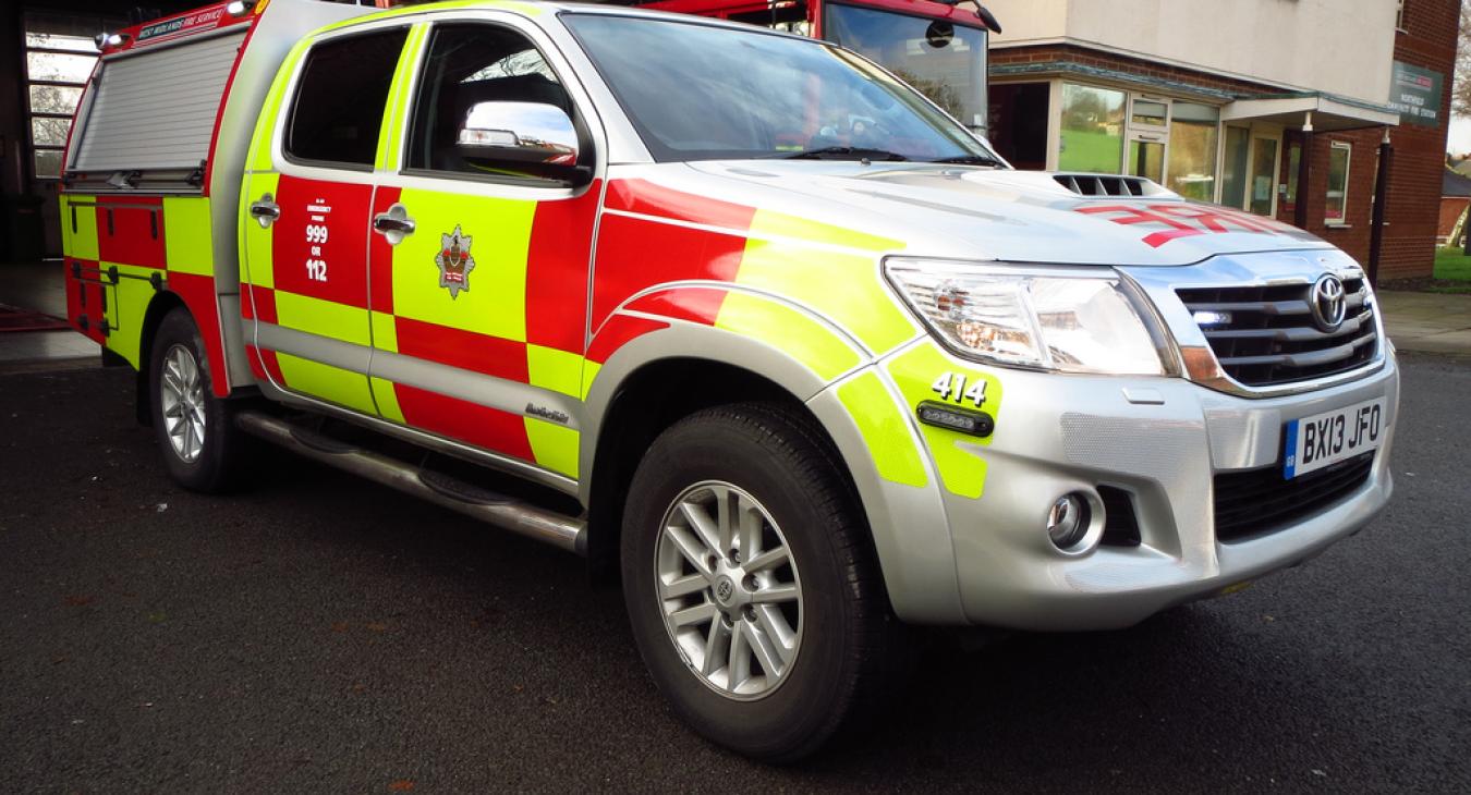 A large car with West Midlands Fire and Rescue Service insignia