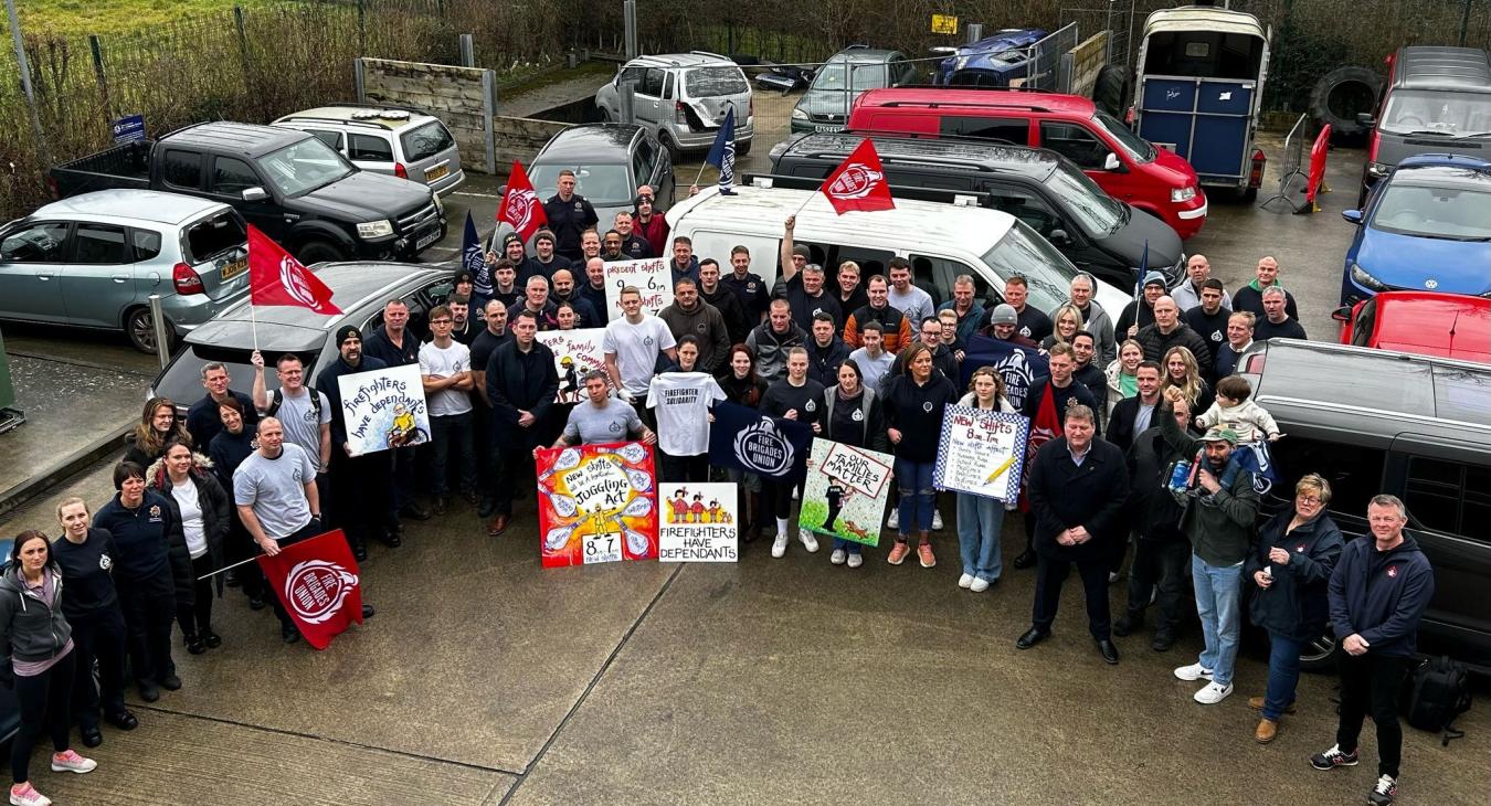 FBU members gathering with signs at meeting against shift changes