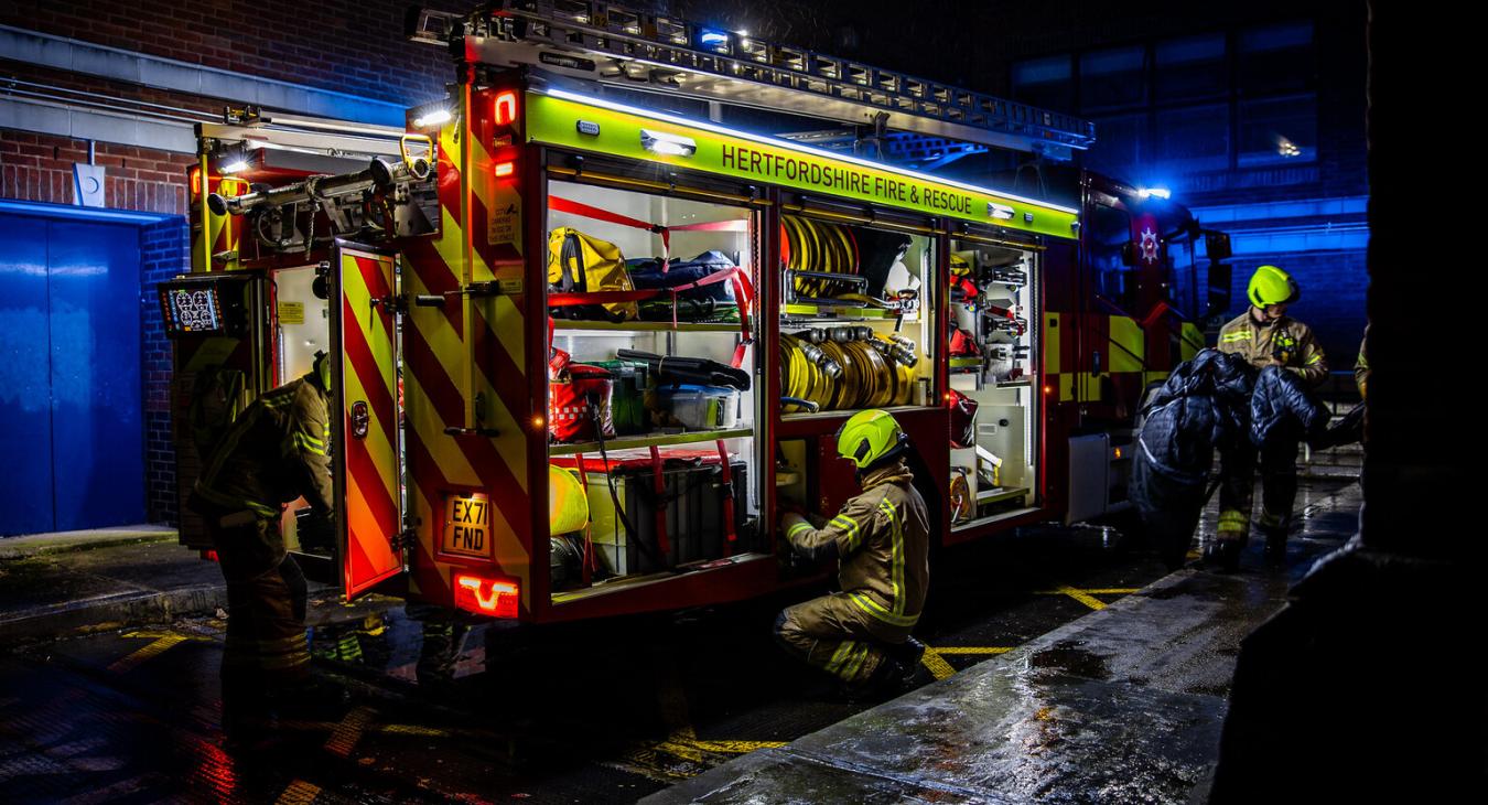 Firefighters working around fire truck - photo comp entry