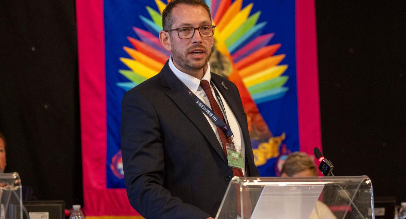 Steve Wright speaking at the podium of FBU conference 