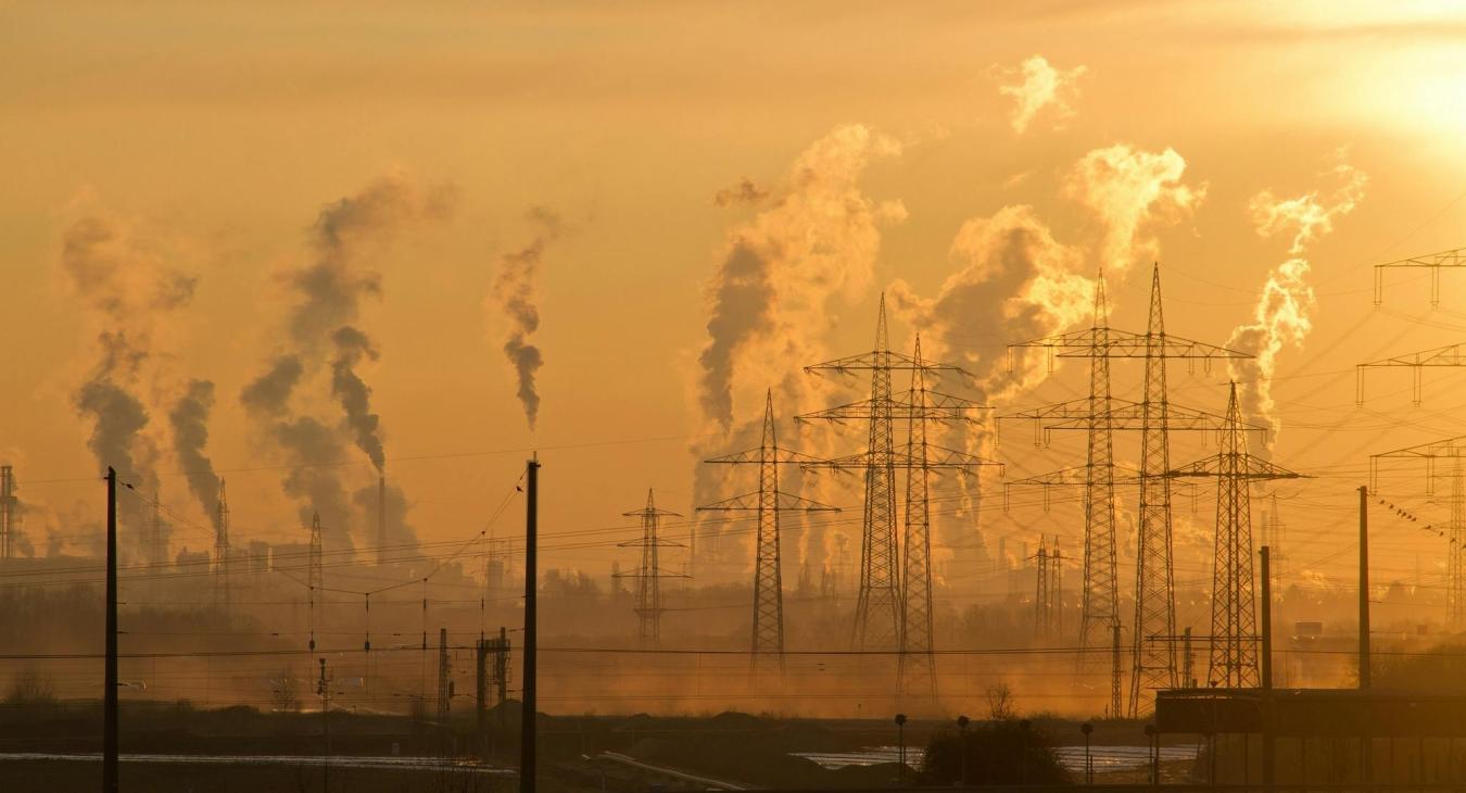 A landscape with pylons and polluted air