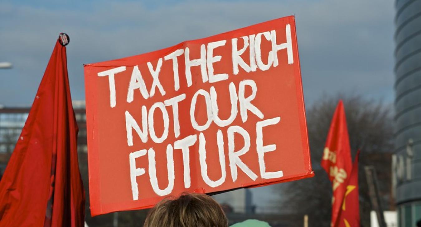 Placard reading tax the rich not our future