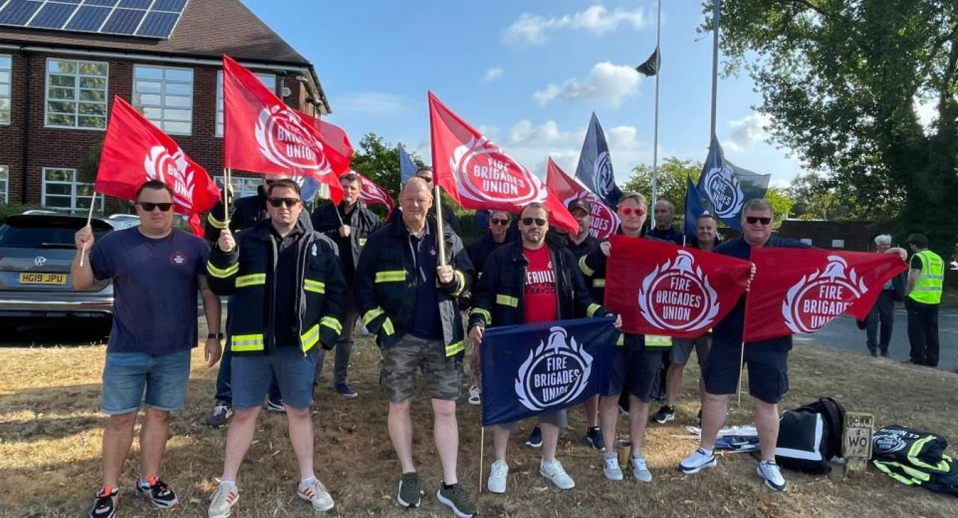 FBU members rally with flags outside fire authority meeting