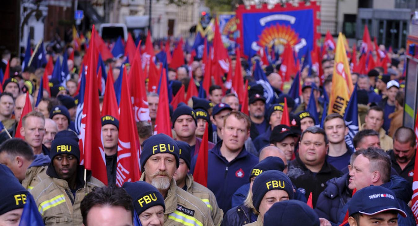 march with FBU flags in street - 2023 rally