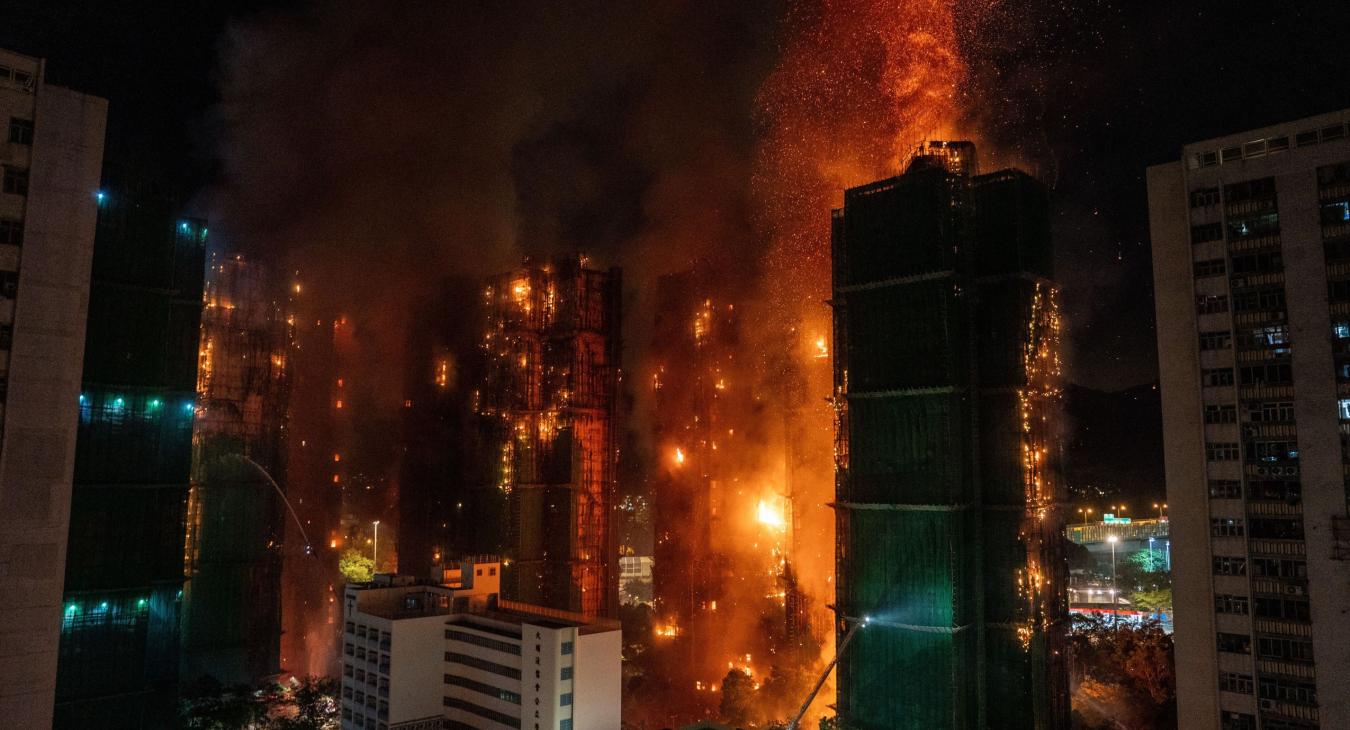 A huge fire rages across multiple apartment blocks