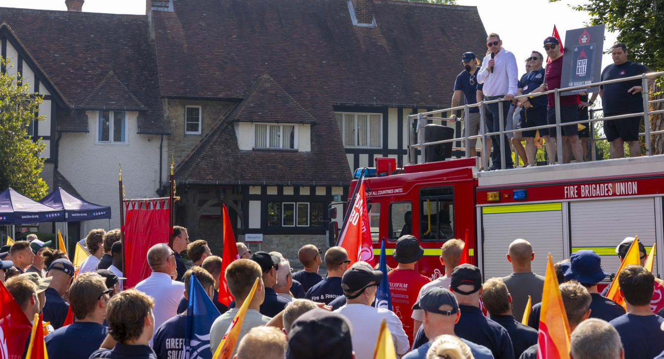 FBU General Secretary Steve Wright addresses a crowd from a Fire Appliance