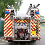 Fire appliance behind daylight scene