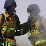 two firefighters smoke