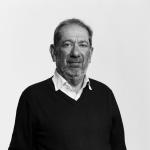 Elkan Abrahamson looking at camera in black and white